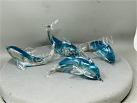 4 glass dolphin figures