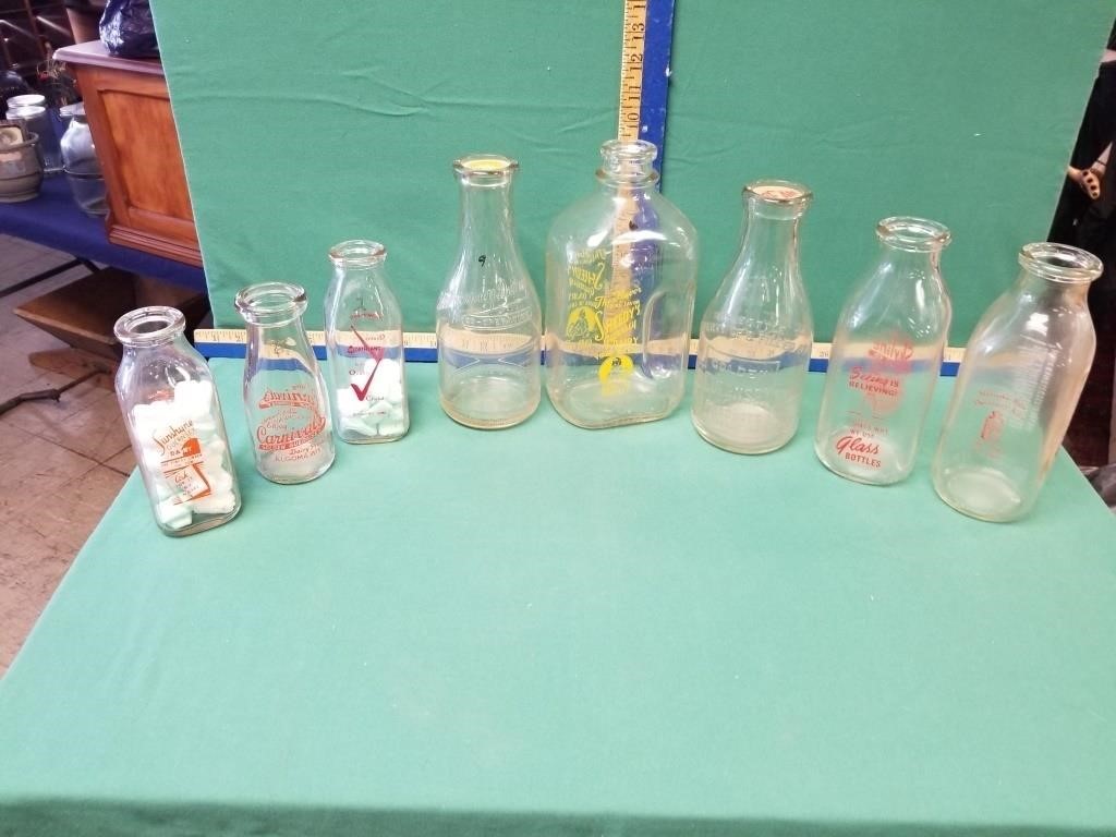 8 ADV MILK BOTTLES