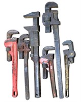 (5) pipe wrenches and (1) monkey wrench