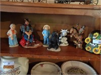 Shelf of cowboy, bear, misc figurines