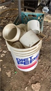 Bucket of assorted PVC parts
