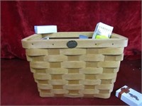 Peterboro basket w/ new items in side.