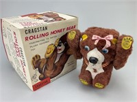 Antique Battery Powered Rolling Honey Bear.