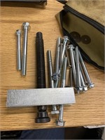 Puller with different sized bolts. In a bag