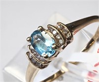 $800. 10kt. Blue Topaz Ring (Size 8.5)