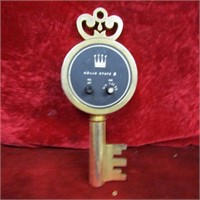 Vintage brass key figural radio.
