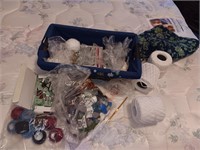 Basket of sewing items, yarn thread more.