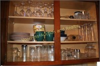 Glasses, plates, setem ware in kitchen cabinet