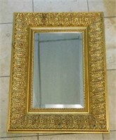 Ornate Gilt Wood Framed Beveled Mirror.