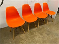 4 Orange Hard Plastic Chairs
