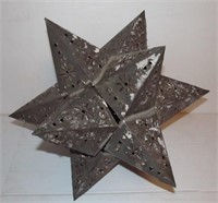 Tin 12 point star candle holder. Measures 15" in