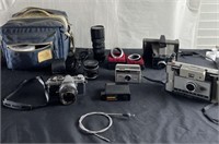 Vintage cameras, lenses, cables, and bag