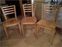 three wood chairs