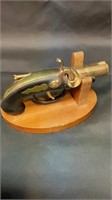 Pistol lighter with stand