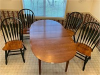 Oak table with 4 chairs. One leaf