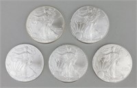 5 2010 One Ounce Fine Silver Eagles.