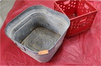 Galvanized bucket and red crate.