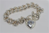 Heavy silver bracelet with heart lock