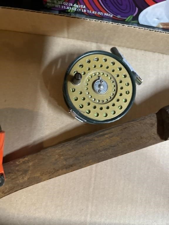 Machete, tape measure, and fishing reel