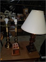3 table lamps and terracotta block on wooden