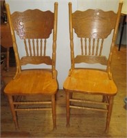 (2) Matching wood dining chairs.