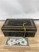 Small antique metal lock box with key