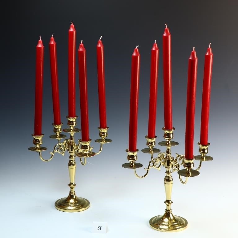 A pair vintage of brass candelabras with candles