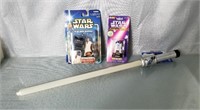 2 Star Wars Figurines and a Light Saber