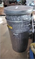 Three galvanized trash cans, 2 lids