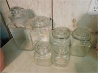 6 clear glass canisters: large, medium, 2 small