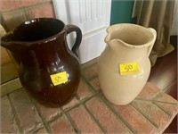 2 antique stoneware pitchers