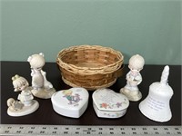 Precious moments figurines and wicker basket