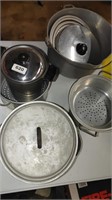 lot of metal pots with misc lids and inserts