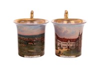 TWO HAND-PAINTED GERMAN SCENIC COFFEE CUPS