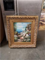 Nicely framed floral ocean view painting