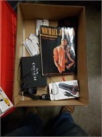 Box of miscellaneous with Michael Jackson body