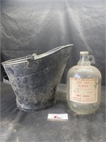 Coal bucket and Apple cider jug