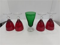 4 ruby stem glasses one green stem glass