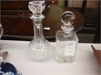Two crystal decanters.