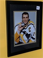 PENS FRAMED PICTURE 12X16 HOLDING PUCK