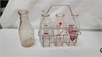 5 EARLY MILK BOTTLES WITH CARRIER