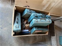Empty Makita tool cases in rolling wood box