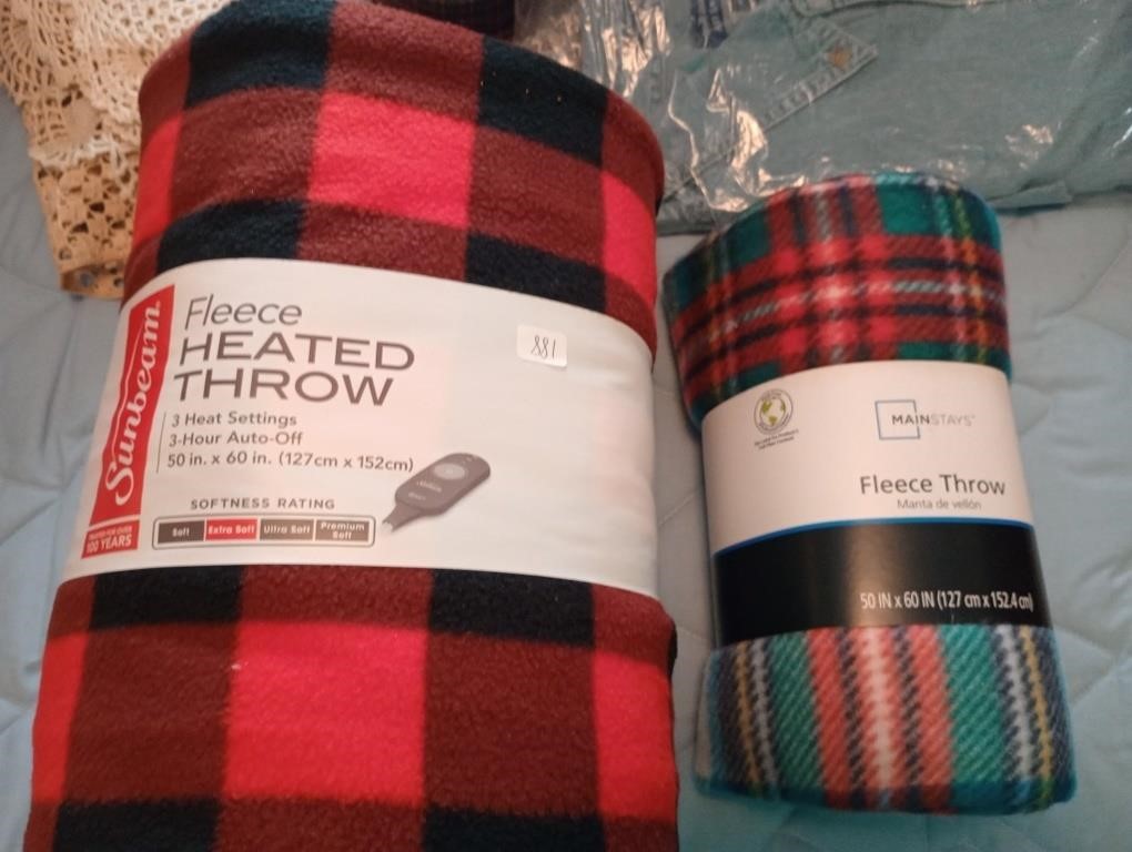 2 new fleece throws, 1 is heated