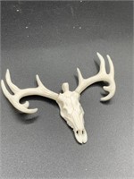 Bone pendant of a caribou skull with its horns, ni