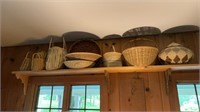 Group of about 10 woven baskets, one with a lid,