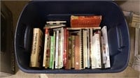 Tub filled with cook books, with a. Few newer