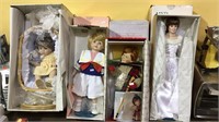 Four porcelain head dolls, with original boxes,