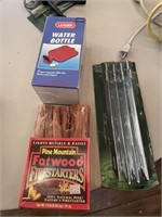 water bottle, firestarters, set of tent stakes,