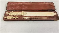 A cased 19th Century ivory paperknife, dip pen,