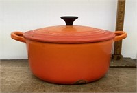 Orange LeCreuset enamel cast iron pot